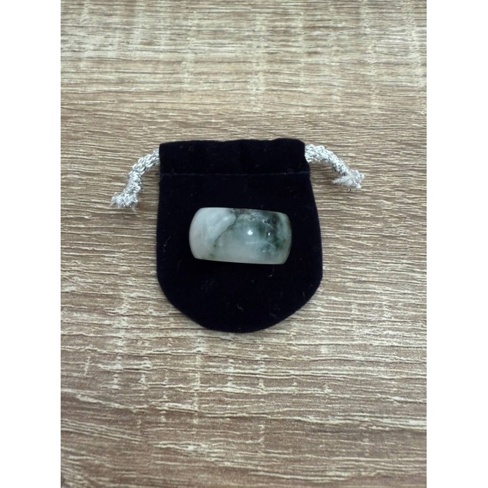 White jade ring with green accents