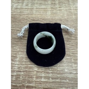 White jade ring with green accents