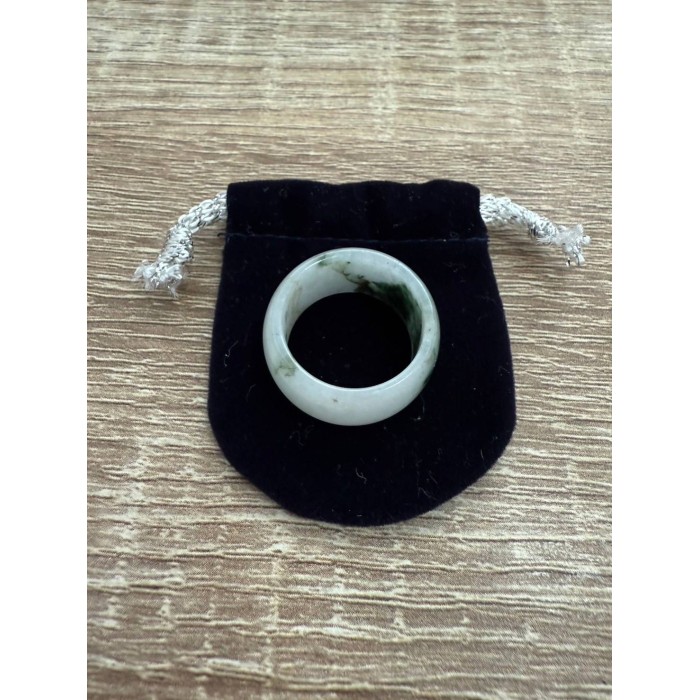 White jade ring with green accents