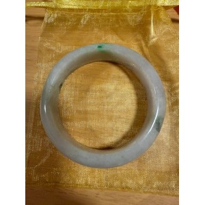 Purple jade bracelet with green accents, a symbol of stability, sustainability and immortality.