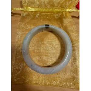 Purple jade bracelet with green accents, a symbol of stability, sustainability and immortality.